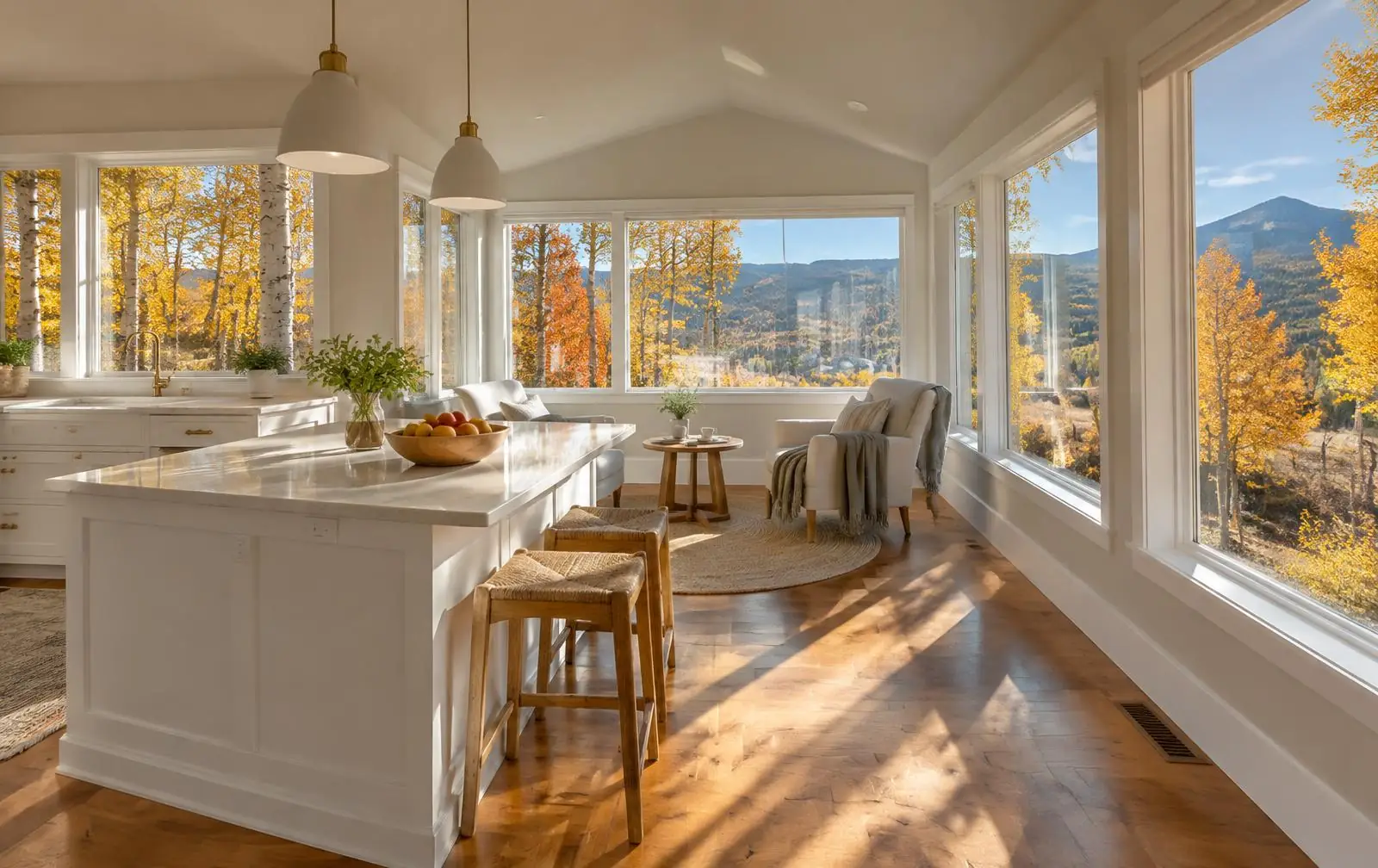 Bright kitchen addition with autumn light through large windows